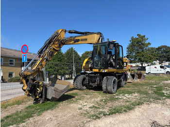 CATERPILLAR M313D Bagger