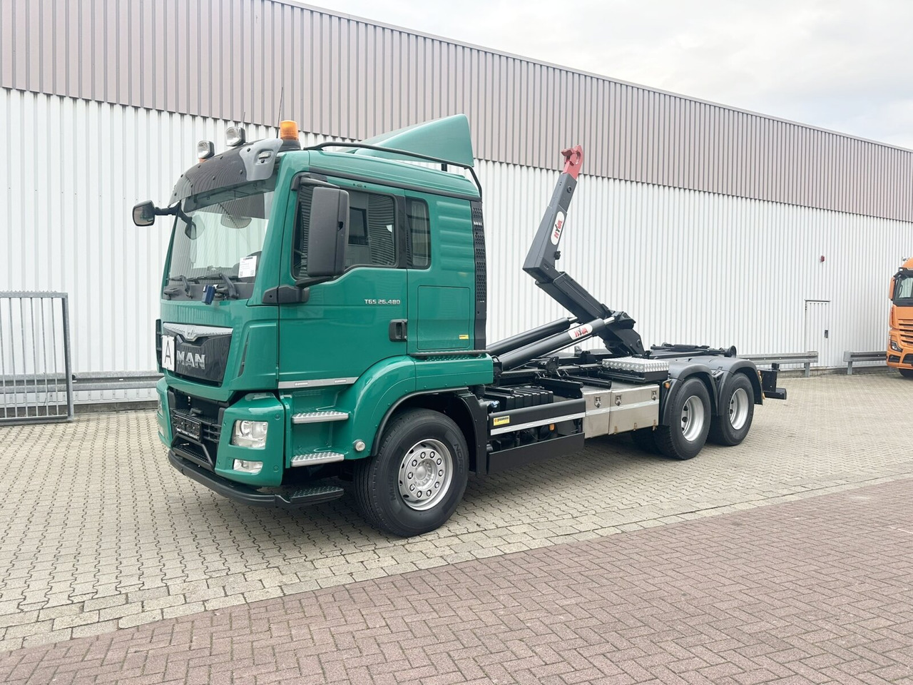 MAN TGS 26.480 6x4 BL TGS 26.480 6x4 BL, Motorabtrieb, Navi, Intarder, Hyva 20.60 S - Abrollkipper: das Bild 1 MAN TGS 26.480 6x4 BL TGS 26.480 6x4 BL, Motorabtrieb, Navi, Intarder, Hyva 20.60 S - Abrollkipper: das Bild 1