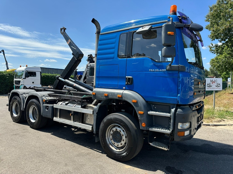 MAN TGA 33.400 6X4 HOOKLIFT AJK NHS20-4930mm - WB 3m60 - MANUAL ZF - STEEL SPRING / BLATT - BIG AXLES / AP ACHSEN - Abrollkipper: das Bild 1 MAN TGA 33.400 6X4 HOOKLIFT AJK NHS20-4930mm - WB 3m60 - MANUAL ZF - STEEL SPRING / BLATT - BIG AXLES / AP ACHSEN - Abrollkipper: das Bild 1