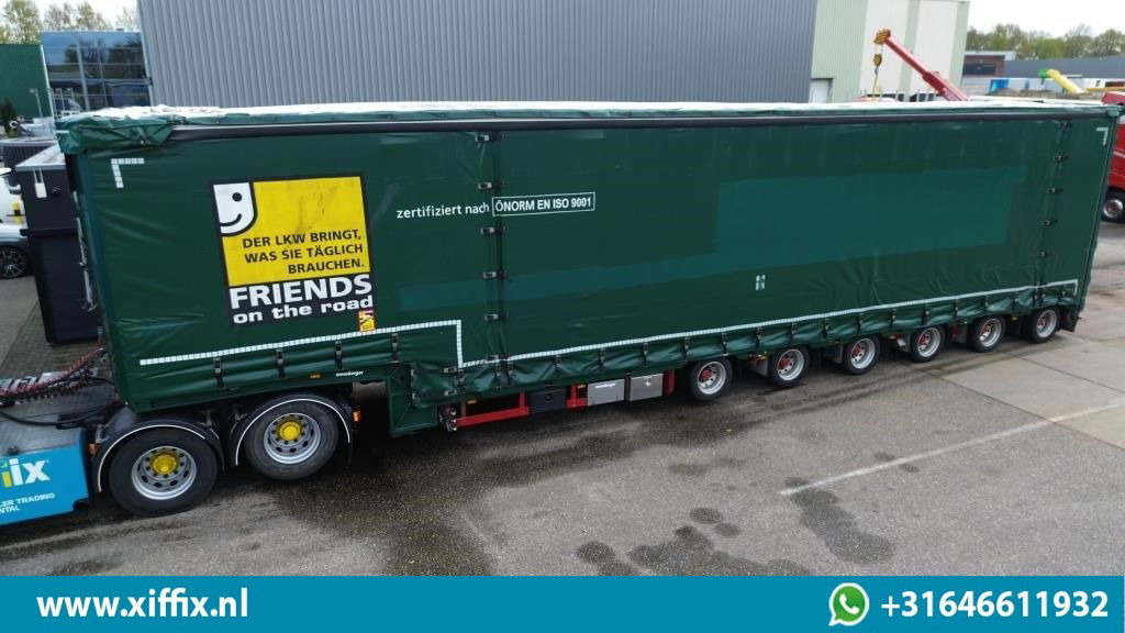 Meusburger 6-ass. Semi dieplader met elektrische huifopbouw / 3x naloop gestuurd - Tieflader Auflieger: das Bild 1 Meusburger 6-ass. Semi dieplader met elektrische huifopbouw / 3x naloop gestuurd - Tieflader Auflieger: das Bild 1