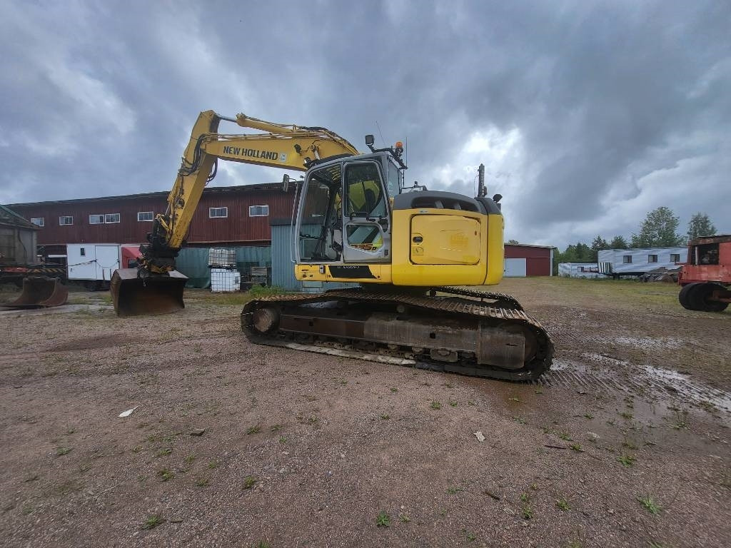 New Holland Kobelco E 235 B SR-2 - Kettenbagger: das Bild 5 New Holland Kobelco E 235 B SR-2 - Kettenbagger: das Bild 5