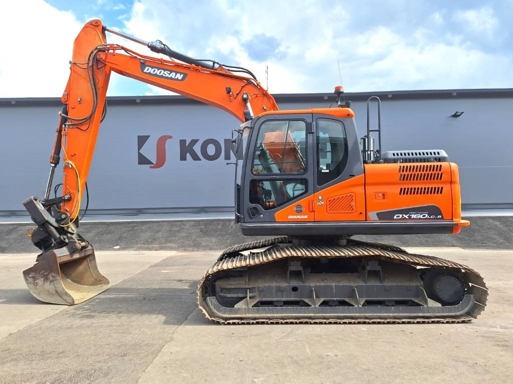 Doosan DX160LCH-5 METSÄMALLI KALLISTAJALLA - Kettenbagger: das Bild 1 Doosan DX160LCH-5 METSÄMALLI KALLISTAJALLA - Kettenbagger: das Bild 1