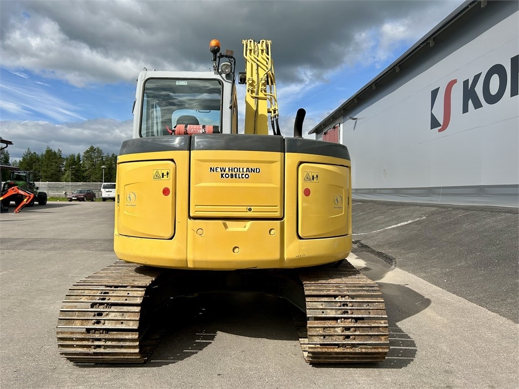 New Holland MYYTY! SOLD! E70BSR 2D MITTALAITTEET - Minibagger: das Bild 3 New Holland MYYTY! SOLD! E70BSR 2D MITTALAITTEET - Minibagger: das Bild 3