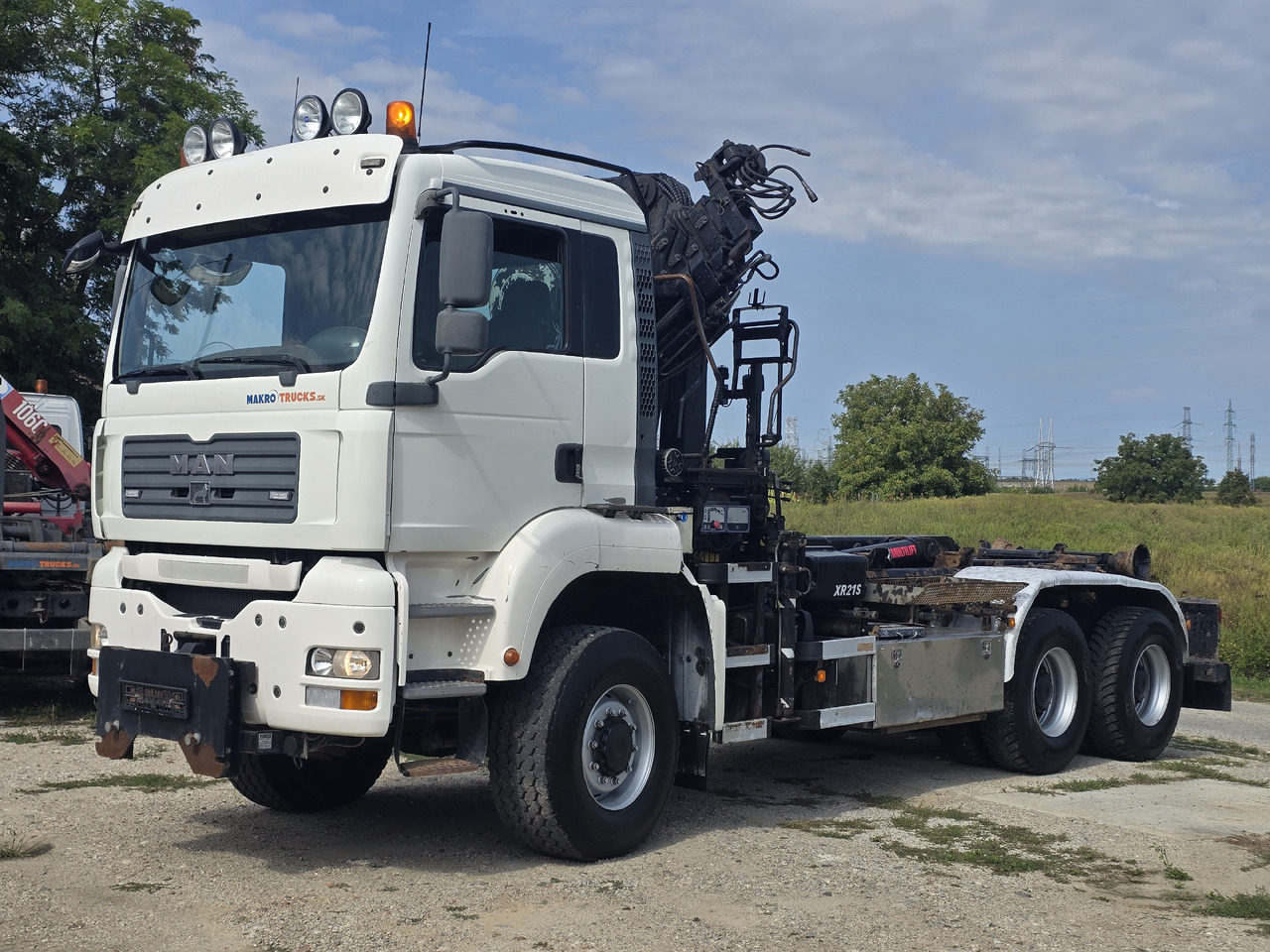 MAN TGA 26.440 6X6 / HOOK SYSTEM / HIAB 166D REMOTE - Abrollkipper, Autokran: das Bild 1 MAN TGA 26.440 6X6 / HOOK SYSTEM / HIAB 166D REMOTE - Abrollkipper, Autokran: das Bild 1