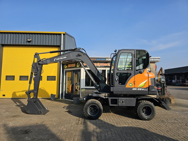 Develon DX60WN ECO-1 - Mobilbagger: das Bild 1 Develon DX60WN ECO-1 - Mobilbagger: das Bild 1