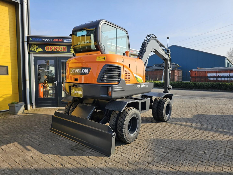 Develon DX60WN ECO-1 - Mobilbagger: das Bild 4 Develon DX60WN ECO-1 - Mobilbagger: das Bild 4