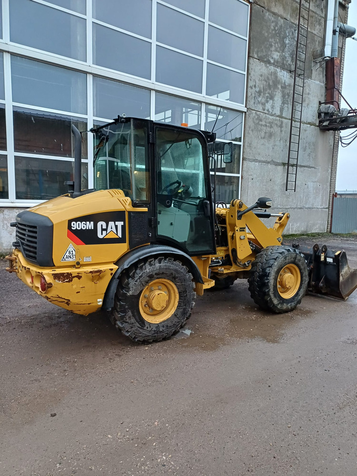 CATERPILLAR 906M - Baggerlader: das Bild 1 CATERPILLAR 906M - Baggerlader: das Bild 1