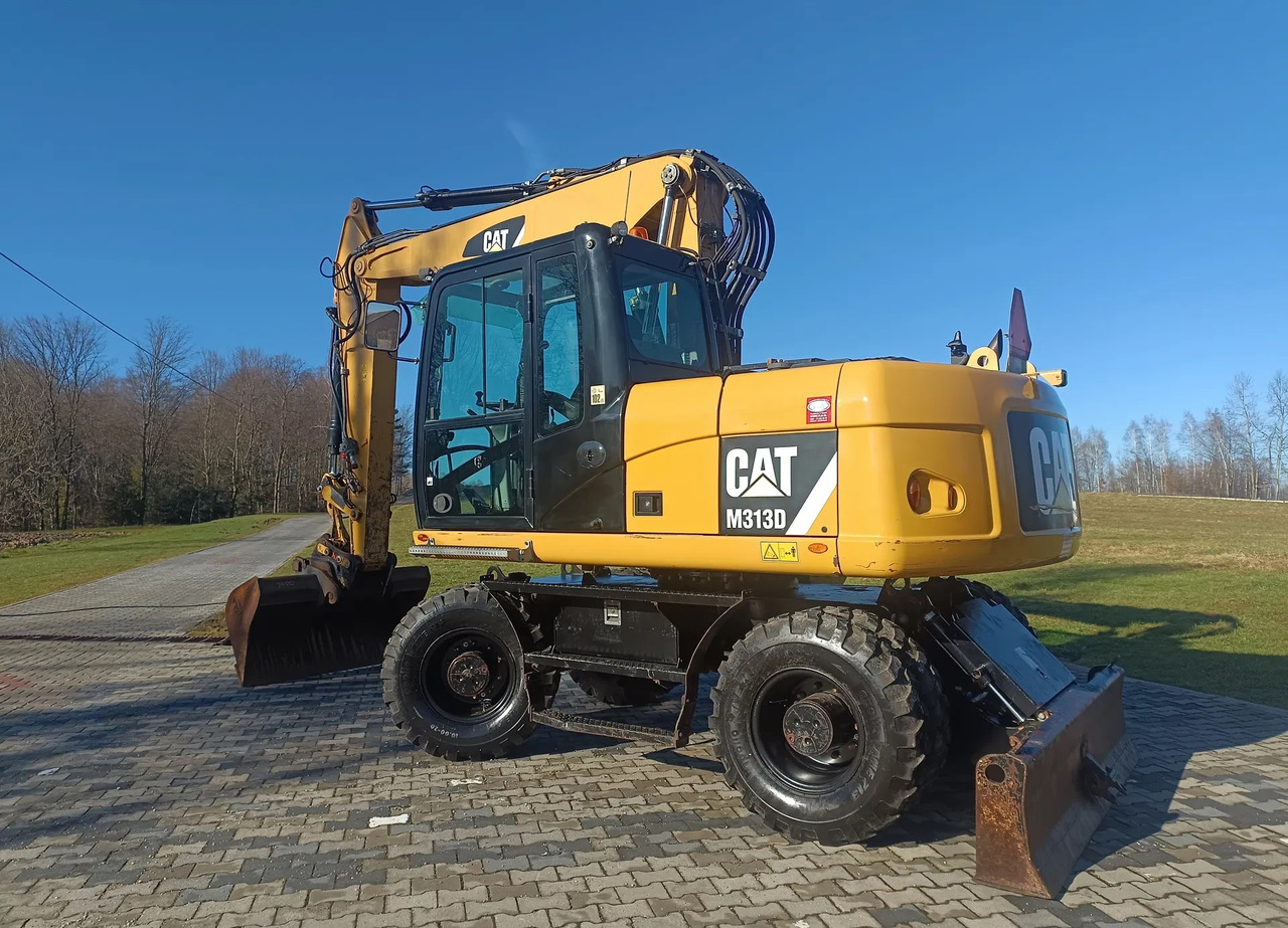 CATERPILLAR M313D - Mobilbagger: das Bild 1 CATERPILLAR M313D - Mobilbagger: das Bild 1