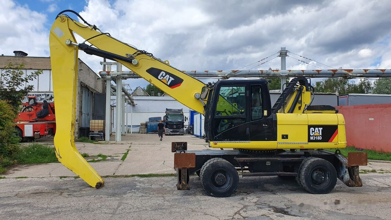 Caterpillar M 318 D MH - Umschlagbagger: das Bild 1 Caterpillar M 318 D MH - Umschlagbagger: das Bild 1