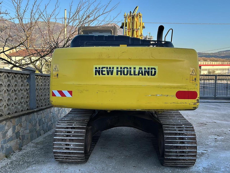 New Holland E245B - Bagger: das Bild 5 New Holland E245B - Bagger: das Bild 5