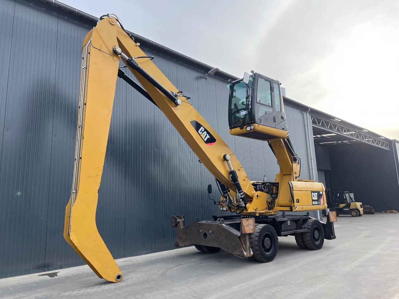 Caterpillar M 322D MH - Baggerlader: das Bild 1 Caterpillar M 322D MH - Baggerlader: das Bild 1